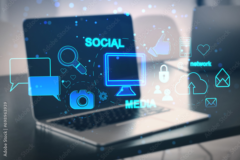 Poster close up of laptop on desk with creative social media interface with emails, speech bubbles, mobile 