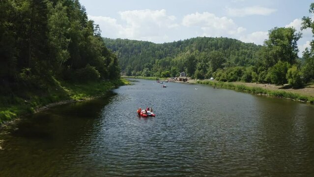 Aerial view of catamarans rafting on a river Agidel in Bashkortostan. Summer activities on a river