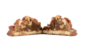 Nut cookies with boiled condensed milk cut into two parts on a white background.