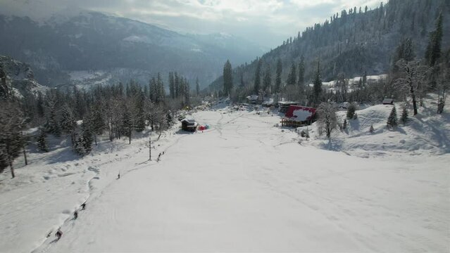 ITS A ARIEAL DRONE SHOTS OF ICE MOUNTAION AND ANOTHER MOUNTAION IN MANALI,INDIA