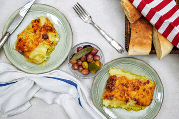 Traditional chicken shepherd pie offered as closeup in a rustic ceramic modern design plate