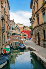 beautiful Venetian canal in Venice with water taxis, boats, gondolas in September 2023. Travel and tourism