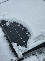 Renewable energy solar PV panels covered with white snow. - 698982178