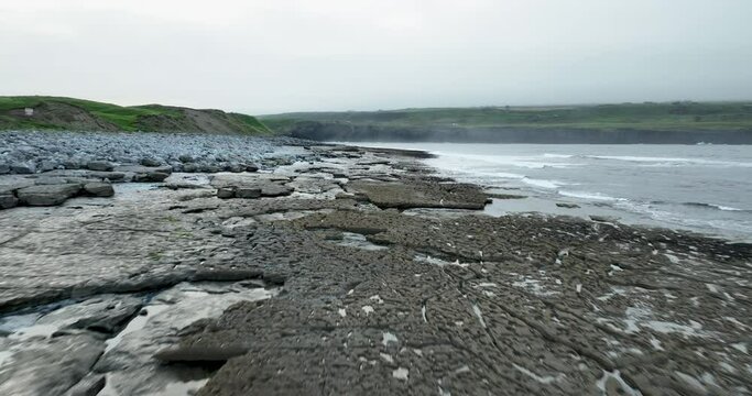 The stone coast of the Atlantic Ocean in 4k