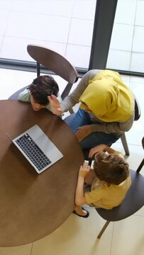 Muslim family video conference with laptop during Eid Adha, Ramadan, Aid Fitar holiday. Connect with the family from a distance, always connected, transnational family.