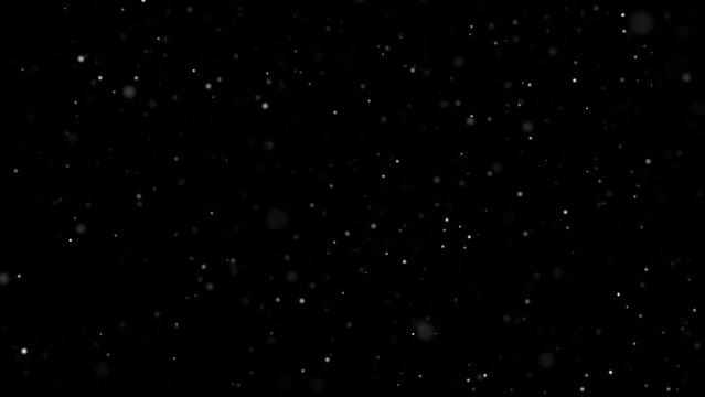 White snow bokeh falling overlay on black background. abstract dust particles snowflakes and snowfall slowly falling motion effect for christmas holiday festival. Luxury decorative element.