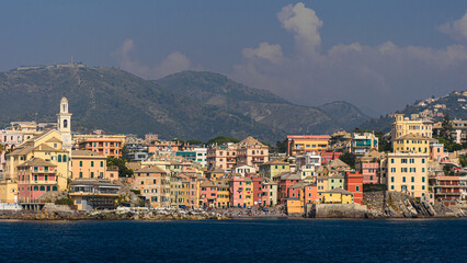 Fototapeta na wymiar Boccadasse, small sea district of Genoa, seen from the sea. Liguria, Italy.