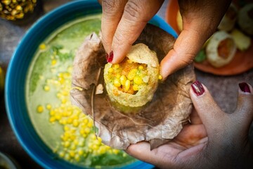 Golgappa and Puchka, Woman hand holding panipuri indian ball snack famous delicious food India....