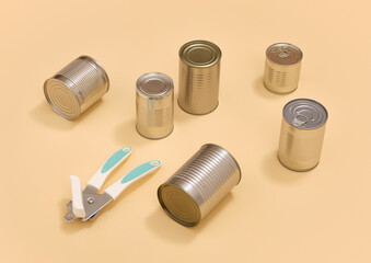 Canned food and a can opener. Preparing lunch or dinner.