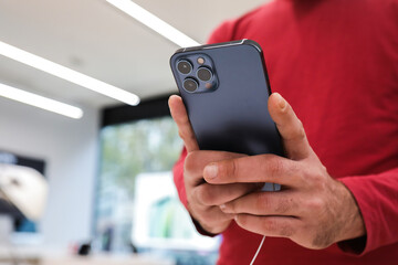 Cellular business phone mobile technology gadget device handheld advance new version navy blue color in hand with space for design