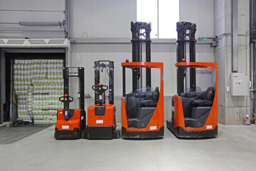 Pallet Truck Forklift Vehicles in Distribution Warehouse