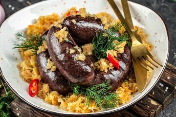 Baked blood sausage with sauerkraut. banner, menu, recipe top view