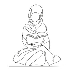 Muslim woman praying and reading the Koran