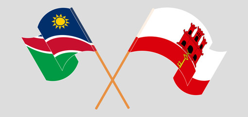 Crossed and waving flags of Namibia and Gibraltar