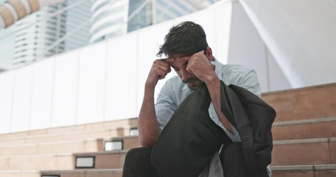businessman feels stressed and depressed due to unsuccessful business operations and being fired from his job. Concept business failure