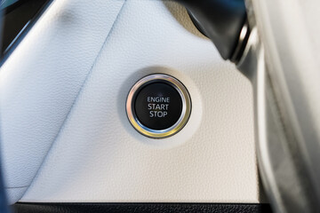 Close up engine car start button. Start stop engine modern new car button,Makes it easy to turn your auto mobile on and off. a key fob unique ,selective focus	 - obrazy, fototapety, plakaty