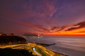 At sunset, Miraflores offers stunning views of the ocean, cliffs, and the vibrant colors in the...