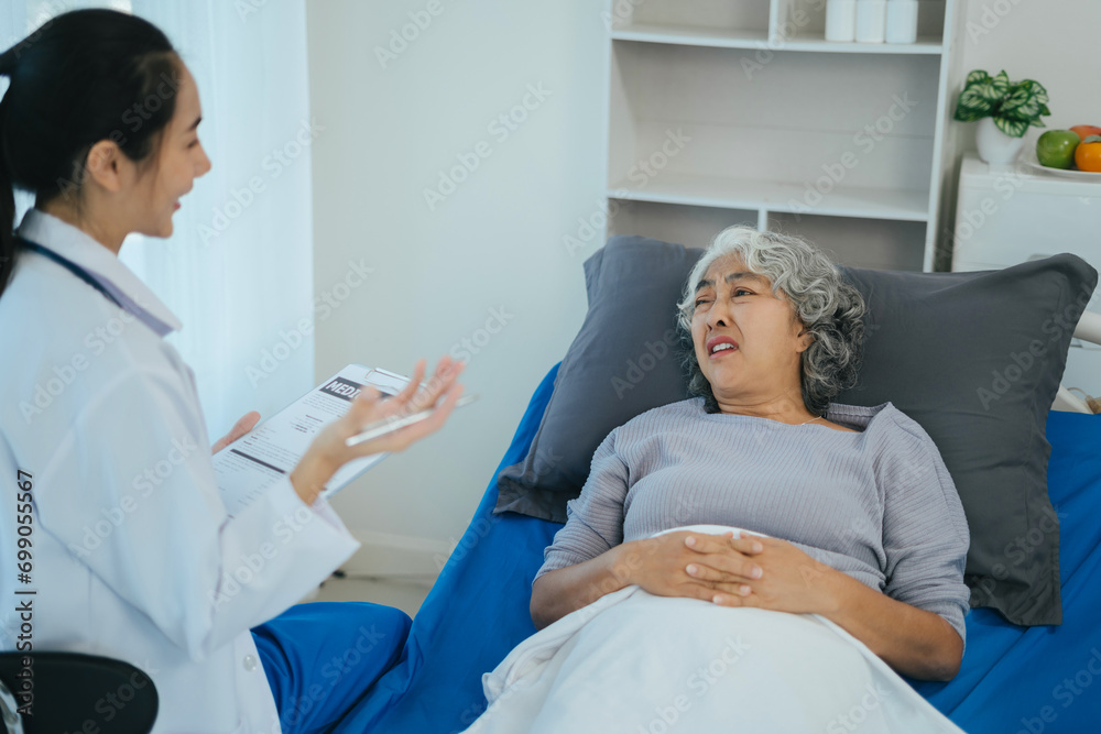 Wall mural doctor talking with woman patient for monitoring and check up after surgery. doctor touching patient