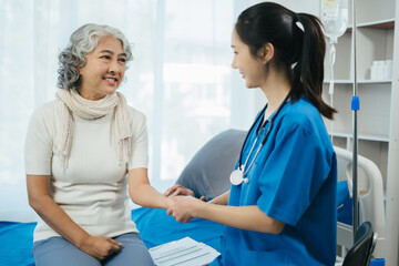 Close up of medical worker putting his fingers on a wrist of a female patient while checking her pulse during an appointment.Taking care of health.