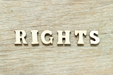 Alphabet letter in word rights on wood background