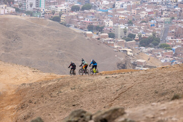 Enduro bikers challenging the lines at el Morro Solar Chorrillos Lima Peru