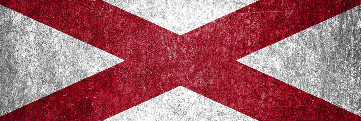 Banner of Alabama grunge state flag. Dirty Alabama state flag on a metal surface.