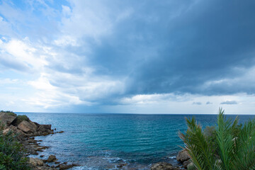 Looking at the sea from the coastal green area. Looking at the sea from the rocks on a cloudy day....