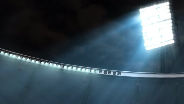 Stadium or arena lit up by lights and reflectors turning on.