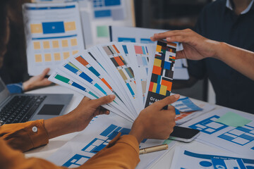 Close up ux developer and ui designer use augmented reality brainstorming about mobile app...