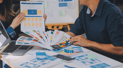 Close up ux developer and ui designer use augmented reality brainstorming about mobile app...