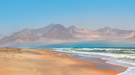 Fototapeta na wymiar Namib desert with Atlantic ocean meets near Skeleton coast - Namibia, South Africa