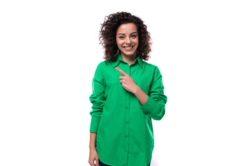 pretty young business woman dressed in a green shirt on a white background with copy space