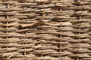 texture of wooden wicker fence closeup