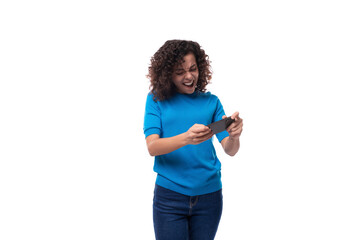 young cool woman with curly natural hair styling watching video