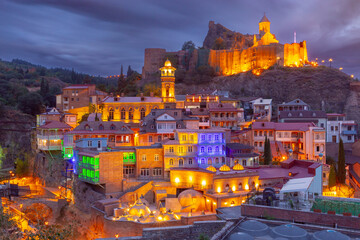 Old medieval fortress  in Tbilisi at sunset. - obrazy, fototapety, plakaty