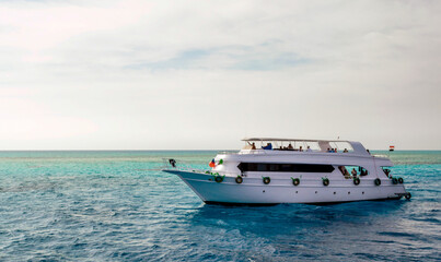 white cruise tourist boat in the Red Sea in Egypt
