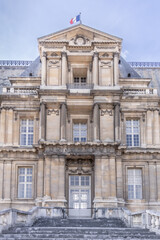 Fototapeta na wymiar French-chateau-stone-facade-flag