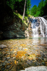 Fototapeta na wymiar Hiking to the Kuenser Waterfalls near Meran in South Tyrol Italy. 