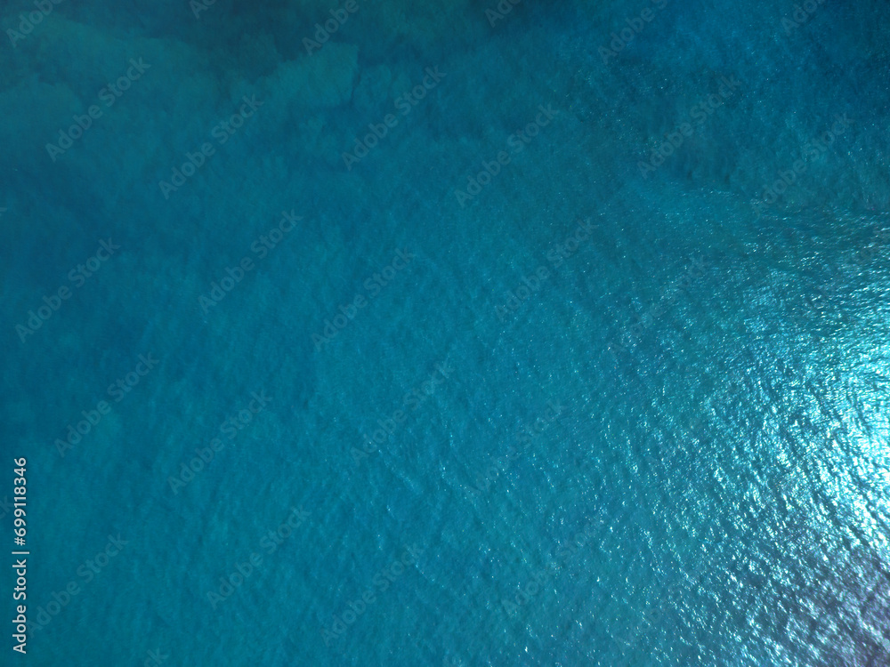 Wall mural aerial top down shot of ocean.