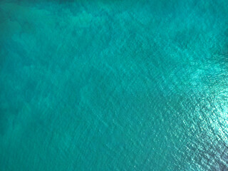 Aerial view of a crystal clear sea texture.
