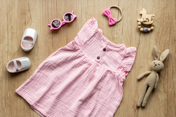 Fashion trendy look of baby girl with pink dress and accessories