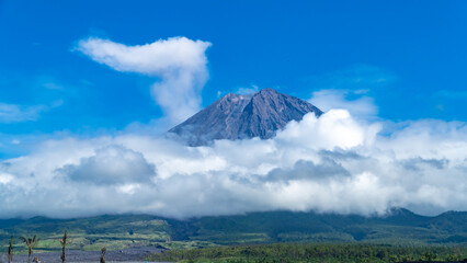 Eruption of Volcano Semeru on the island of Java. The volcano emits ash and smoke. Natural...