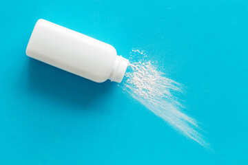 White container with talcum powder for baby body care