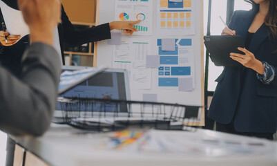 Close up ux developer and ui designer use augmented reality brainstorming about mobile app interface wireframe design on desk at modern office.Creative digital development agency