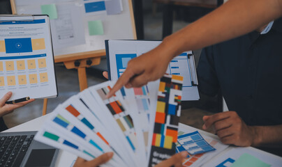 Close up ux developer and ui designer use augmented reality brainstorming about mobile app...