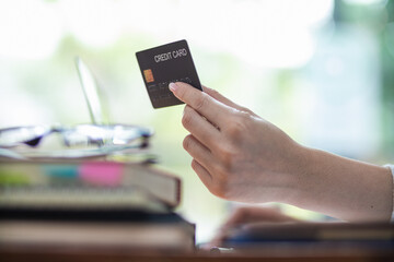 business woman is using credit card to pay for products online when ordering products from store through an online website because using credit card to pay for products brings convenience in shopping
