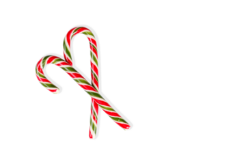 New Year's sticks candy canes with stripes on a white isolated background close-up