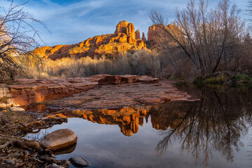 Cathedral Rock sunset at Oak Creek with reflection. Sedona, Arizona in winter