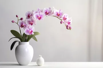 Foto op Plexiglas very beautiful pink orchid flowers in a vase on the table, white background © JetHuynh
