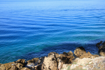 Clear Blue sea water wit waves.  Sea waves. Blue ocean background. Beautiful crystal clear sea water in Croatia. Beautiful landscape with turquoise blue water. Vacation and summer concept. Copy space 
